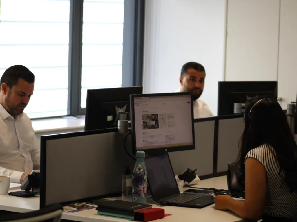 Insight Systems team members working together in the office