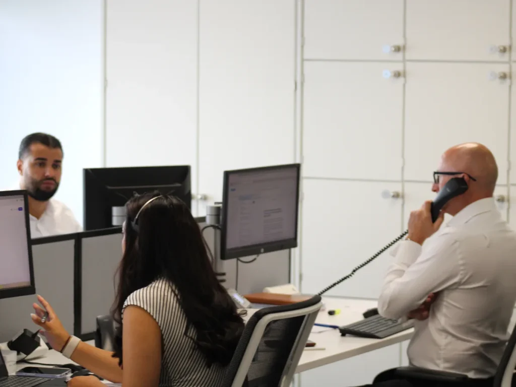 Members of the Insight Systems team answering enquiries