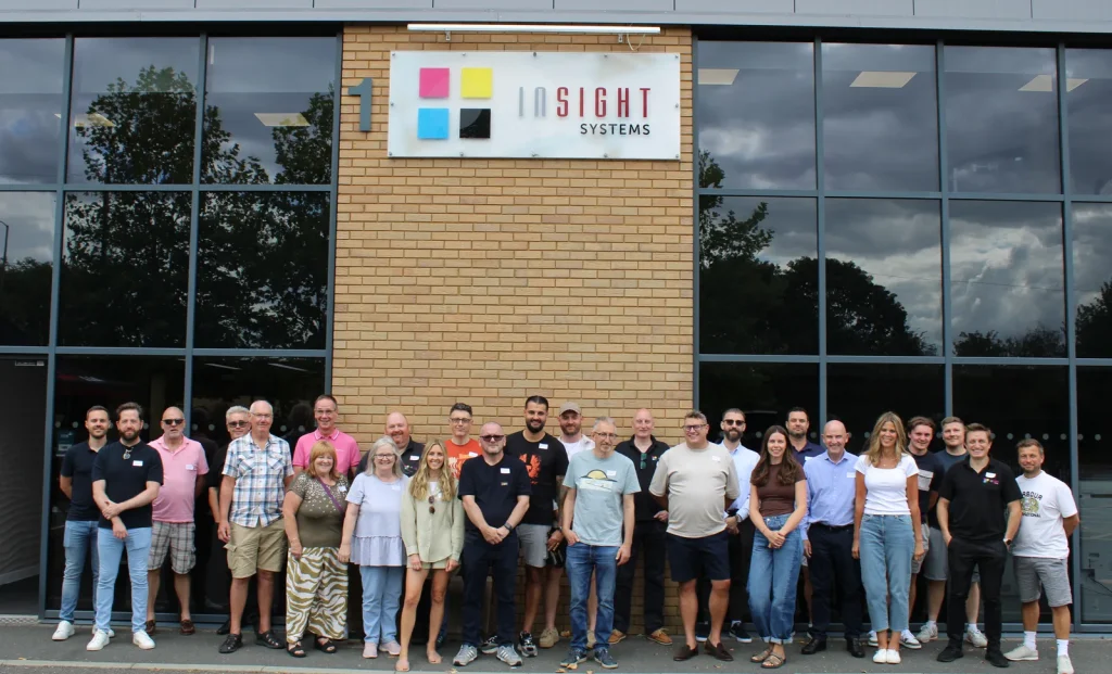 The whole Insight Systems team together outside the office